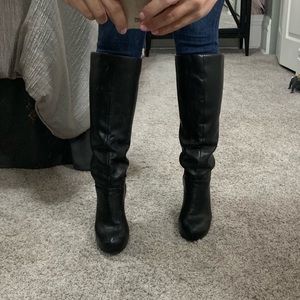 Black chunky heel knee high boot.